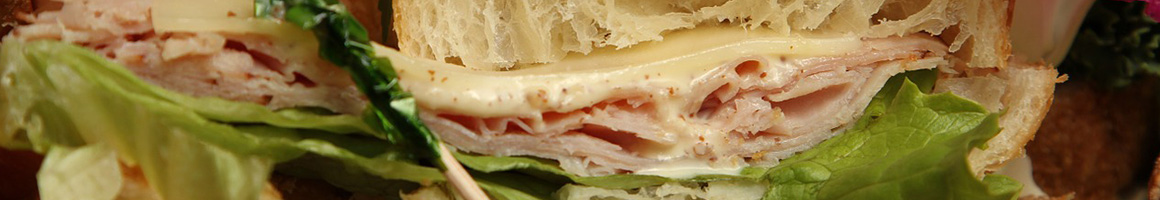 Eating Sandwich at Linda's Steak Subs restaurant in Brooklyn Park, MD.